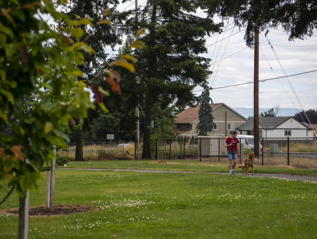 Emily Jackson of Vancouver walks her 1-year-old golden retriever, Ranger, at Nikkei Park. Vancouver Parks and Recreation will host a celebration in honor of the park's renaming at 7 p.m. July 15. Nikkei Park left behind its placeholder, North Image, for a title with deeper meaning and roots to the community, which was officially adopted in September 2021.