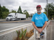 Tom Lineham poses for a portrait on West Mill Plain Boulevard. The roadway "is not known for its beauty or aesthetics," he said. "It's doesn't have a lot of charm.