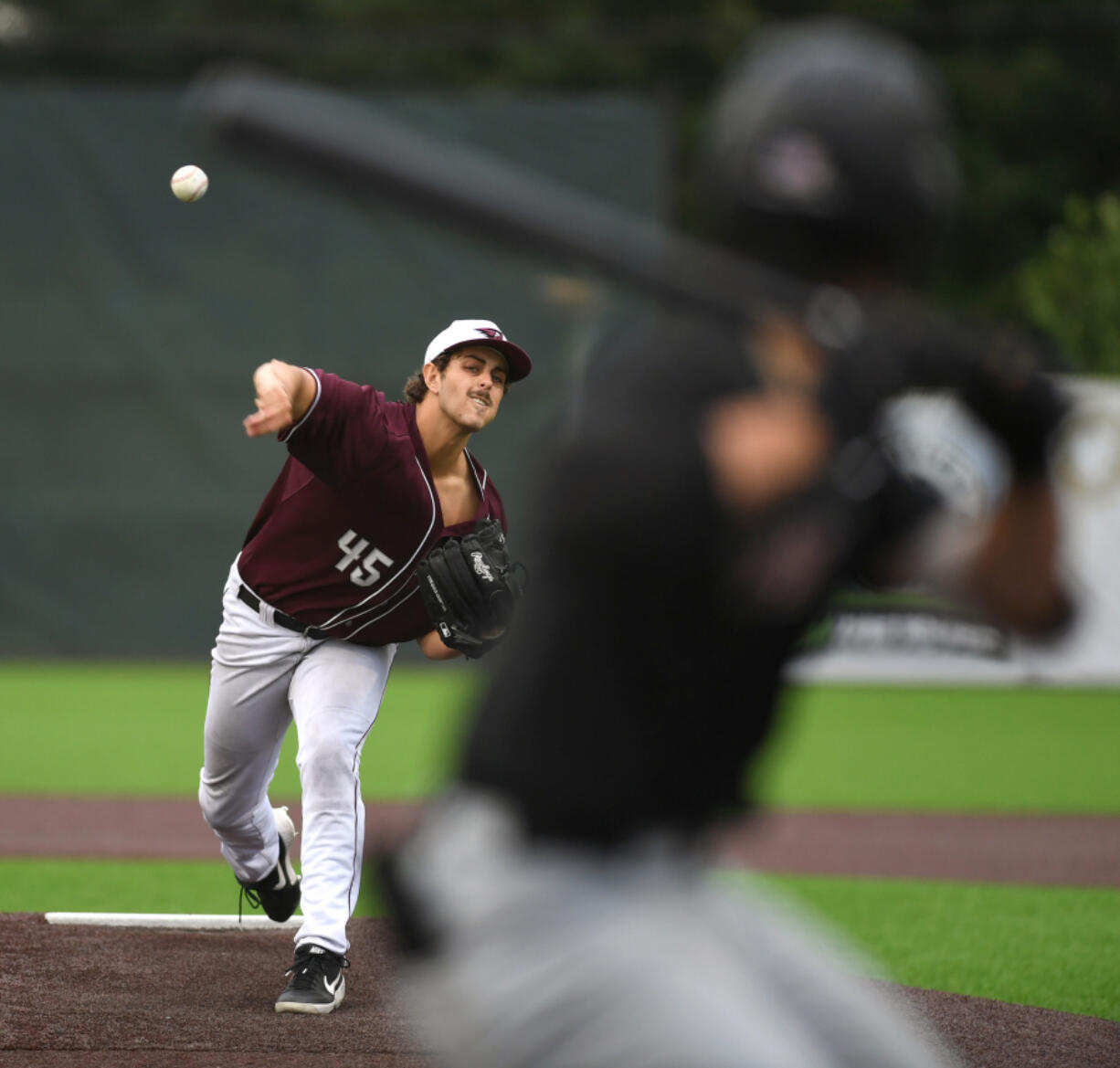Raptors pitcher Cooper Rons throws the ball Wednesday, July 6, 2022, during a game between the Ridgefield Raptors and the Corvallis Knights at the Ridgefield Outdoor Recreation Complex.