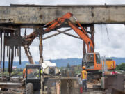 Construction crews continue the demolition of the former Red Lion at the Quay hotel on Wednesday, July 6, 2022 on the Vancouver waterfront.