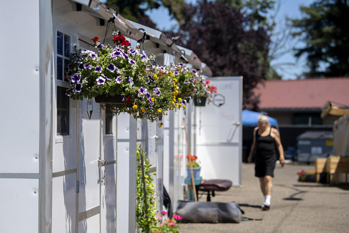 Colorful summer flower baskets hang from units at Living Hope Safe Stay Community on Thursday afternoon. The number of households experiencing homelessness in Clark County increased by 1.6 percent from 2020 to 2021, but the number of people new to homelessness fell by 8 percent, a testament to the effectiveness of federal and state efforts to keep people from falling into homelessness during the COVID-19 pandemic, according to Council for the Homeless' 2021 Homeless Crisis Response System Report, which was published this month.