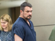 Brian Clement leaves a courtroom Tuesday at the Clark County Courthouse after pleading guilty to second-degree burglary and theft of a firearm. He was sentenced to 7 1/2  years in prison in connection with the stolen firearms trafficking scheme that led to the July 2021 shooting death of Clark County sheriff's Sgt. Jeremy Brown.