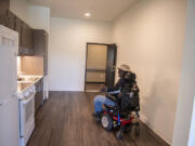 Future resident Deone Washington tours a one-bedroom unit during the grand opening ceremony for Miles Terrace, a new 69-unit affordable housing complex for low-income seniors in downtown Vancouver, on Friday afternoon. "This is going to be a blessing for me," he said.