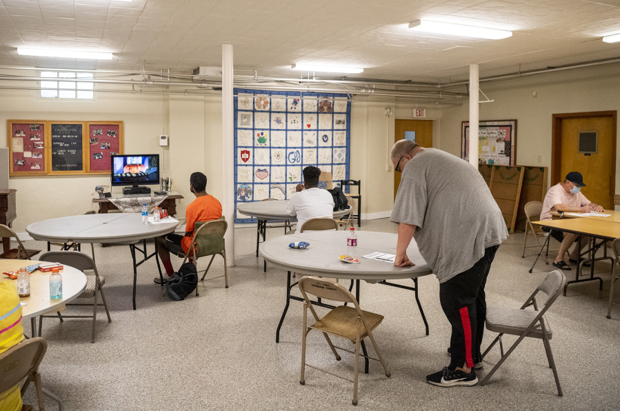 People cool off in the basement of St. Paul Lutheran Church in downtown Vancouver. "People have been coming and going," said Gerri Hiller, a longtime volunteer at the church. "Some of the guys come, but some of them don't. You can't force them.