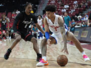 Detroit Pistons' Killian Hayes, right, and Portland Trail Blazers' Keon Johnson vie for the ball during the second half an NBA summer league basketball game Thursday, July 7, 2022, in Las Vegas.