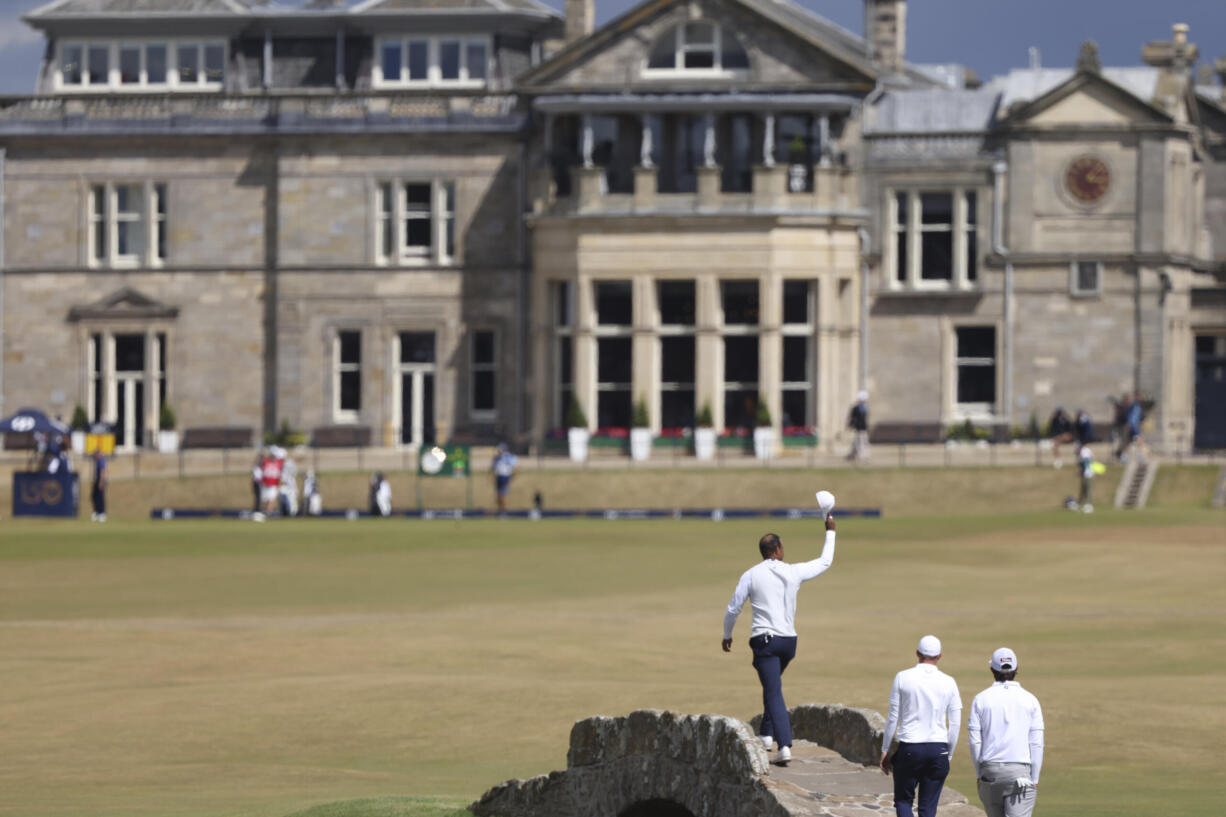 Tiger Woods of the US gestures to the crowd at the end of his second round of the British Open golf championship on the Old Course at St. Andrews, Scotland, Friday July 15, 2022. The Open Championship returns to the home of golf on July 14-17, 2022, to celebrate the 150th edition of the sport's oldest championship, which dates to 1860 and was first played at St. Andrews in 1873.