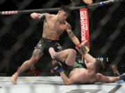 Ricky Simon, left, in action against Jack Shore during their mixed martial arts bout at UFC on ABC 3, Saturday, July 16, 2022, in Elmont, NY. Simon won via 2nd round submission.