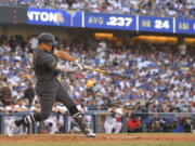 American League's Giancarlo Stanton, of the New York Yankees, swings at a pitch while hitting a two-run home run off National League pitcher Tony Gonsolin, of the Los Angeles Dodgers, during the fourth inning of the MLB All-Star baseball game, Tuesday, July 19, 2022, in Los Angeles. (AP Photo/Mark J.