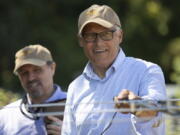 Gov. Jay Inslee waves an antenna to locate a tracker used for tracing Asian giant hornets in Blaine, Wash., Tuesday, July 12, 2022. The Washington State Department of Agriculture hosted a tracking and trapping training session at Birch Bay State Park in Blaine.