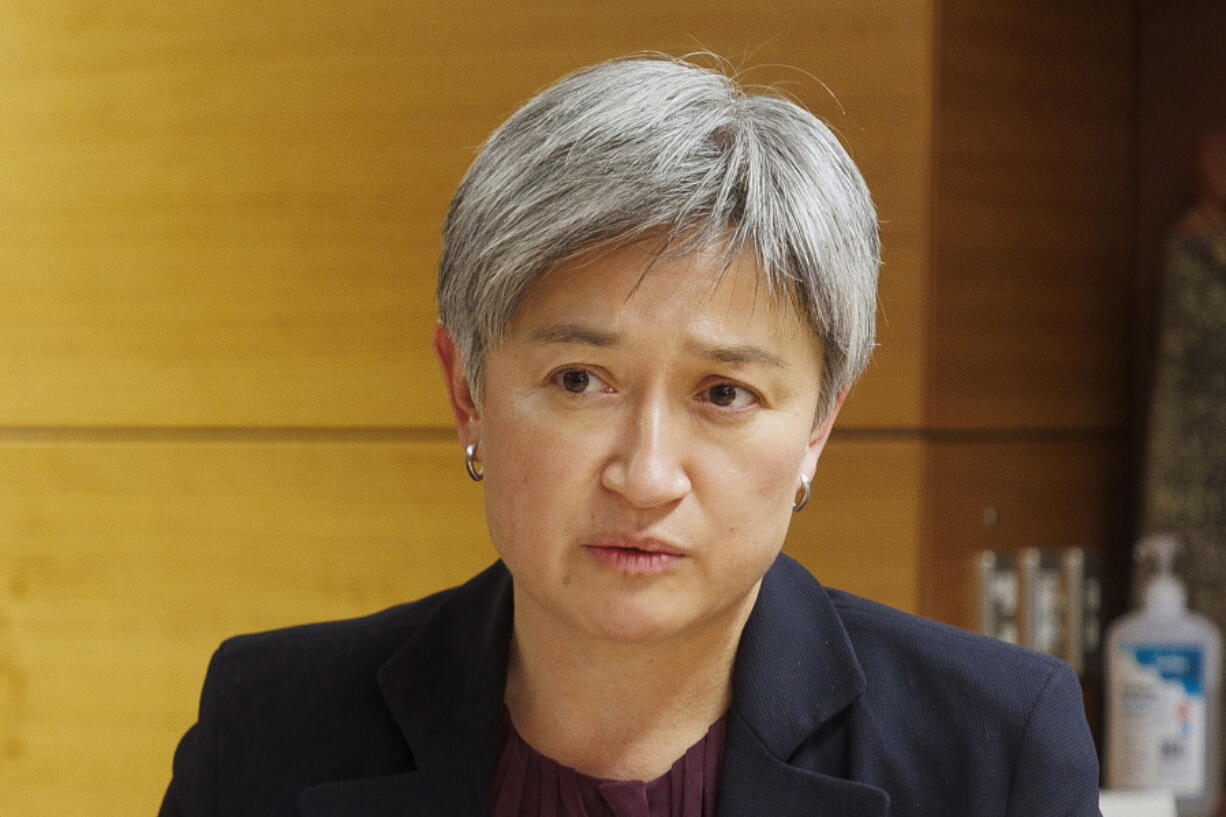 FILE - Australian Foreign Minister Penny Wong talks to New Zealand Foreign Minister Nanaia Mahuta at a bilateral meeting in Wellington, New Zealand on June 16, 2022. Wong on Tuesday, July 12, 2022 urged Pacific island neighbors to unite on their shared challenges of U.S.-China strategic competition, climate change and COVID-19.