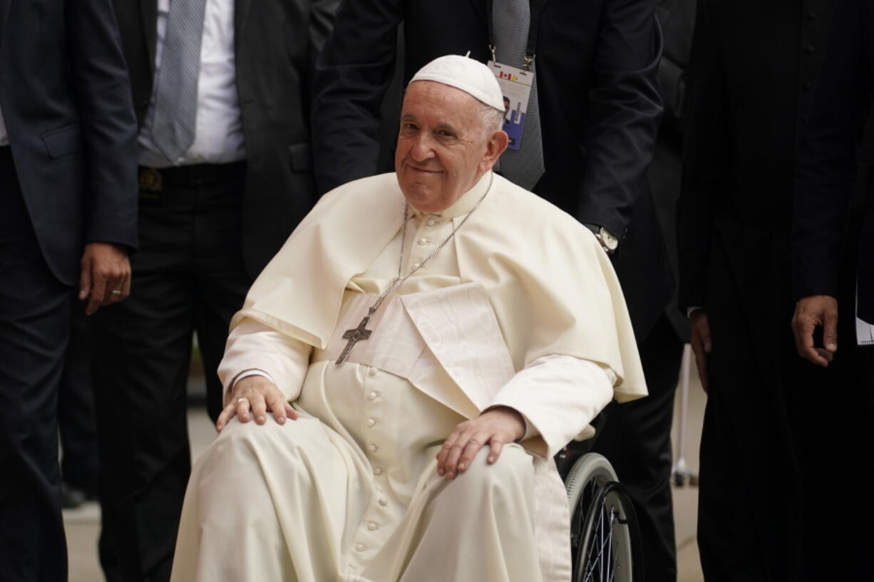 Pope Francis waves as he leaves the parish community of Sacred Heart after a meeting with Indigenous peoples Monday, July 25, 2022, in Edmonton, Alberta.