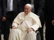 Pope Francis waves as he leaves the parish community of Sacred Heart after a meeting with Indigenous peoples Monday, July 25, 2022, in Edmonton, Alberta.