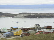 FILE - Small boats make their way through the Frobisher Bay inlet in Iqaluit, Nunavut, Canada on Friday, Aug. 2, 2019.  In his extensive papal travels, Pope Francis has never journeyed further north than Iqaluit, the capital city of the Inuit-governed territory of Nunavut in northern Canada.