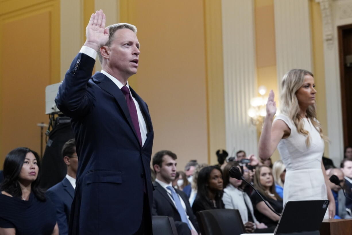 Matt Pottinger, former deputy national security adviser, and Sarah Matthews, former White House deputy press secretary, are sworn in to testify as the House select committee investigating the Jan. 6 attack on the U.S. Capitol holds a hearing at the Capitol in Washington, Thursday, July 21, 2022. (AP Photo/J.