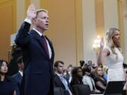 Matt Pottinger, former deputy national security adviser, and Sarah Matthews, former White House deputy press secretary, are sworn in to testify as the House select committee investigating the Jan. 6 attack on the U.S. Capitol holds a hearing at the Capitol in Washington, Thursday, July 21, 2022. (AP Photo/J.