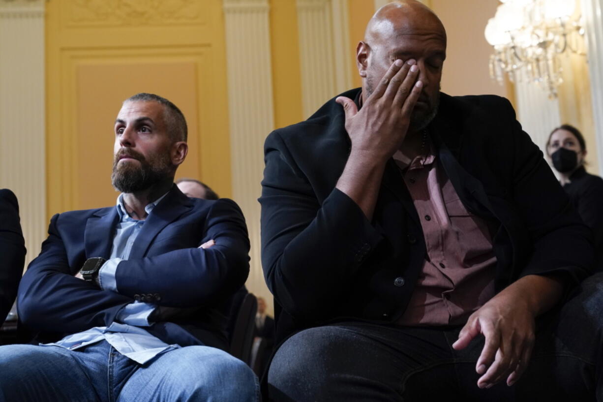 Former Washington Metropolitan Police Department officer Michael Fanone, left, and U.S. Capitol Police Sgt. Harry Dunn listen as the House select committee investigating the Jan. 6 attack on the U.S. Capitol holds a hearing at the Capitol in Washington, Thursday, July 21, 2022. Some of what the House Jan. 6 committee has revealed over the last six weeks about the Capitol insurrection and former President Donald Trump's actions in the weeks beforehand has been new. And some of it has just become more vivid, thanks to the panel's interviews of more than 1,000 witnesses.  (AP Photo/J.