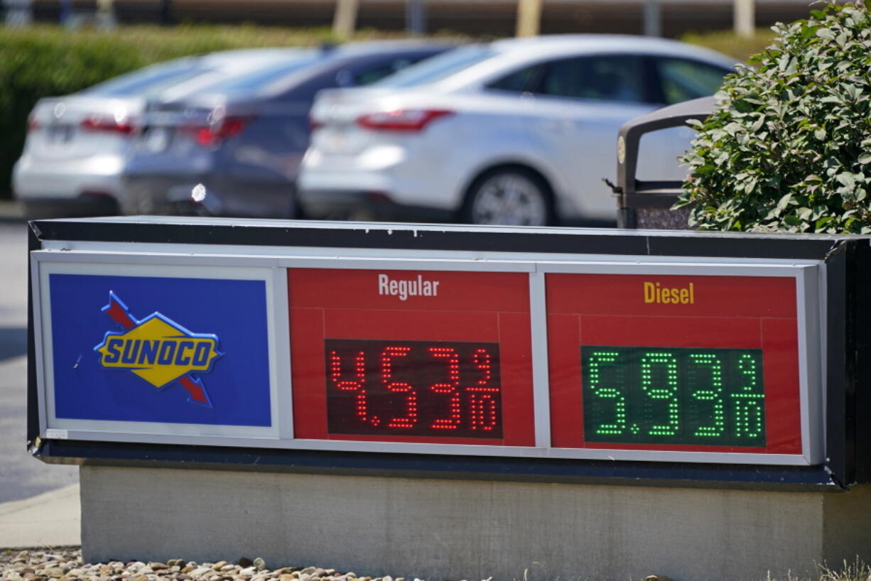 FILE - Gas prices are displayed at a Sunoco gas station along the Ohio Turnpike near Youngstown, Ohio, Tuesday, July 12, 2022. U.S. consumer confidence slid again in July 2022, as concerns about higher prices for food, gas and just about everything else continued to weigh on Americans. The Conference Board said Tuesday, July 26, 2022, that its consumer confidence index fell to 95.7 in July from 98.4 in June, largely due to consumers' anxiety over the current conditions, particularly four-decade high inflation. (AP Photo/Gene J.