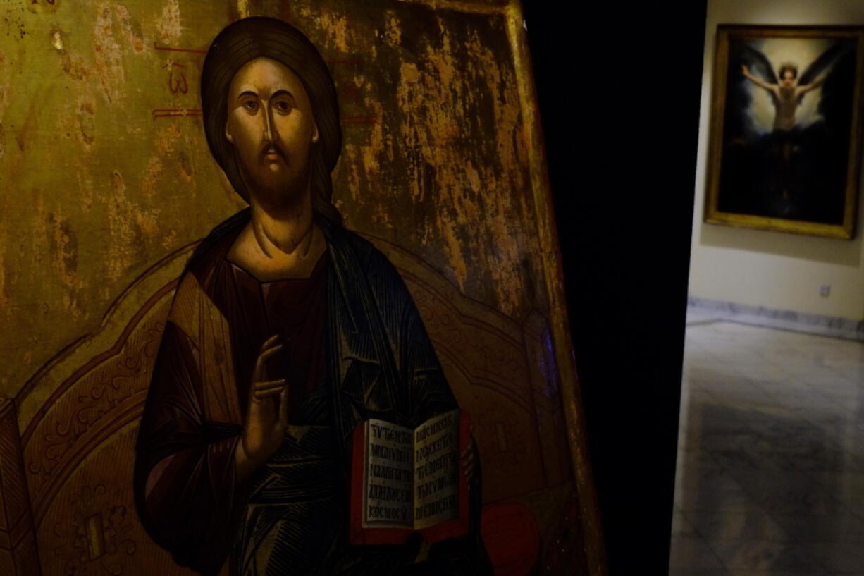 A looted 500 year-old Orthodox icon of the Enthroned Christ is seen at the Byzantine Museum after being returned, in capital Nicosia, Cyprus, on Tuesday, July 12, 2022. A 500 year-old Orthodox icon of the Enthroned Christ that was looted from a 12th century church in the breakaway north of ethnically divided Cyprus was repatriated after the end of a years-long legal journey from Zurich, Switzerland.