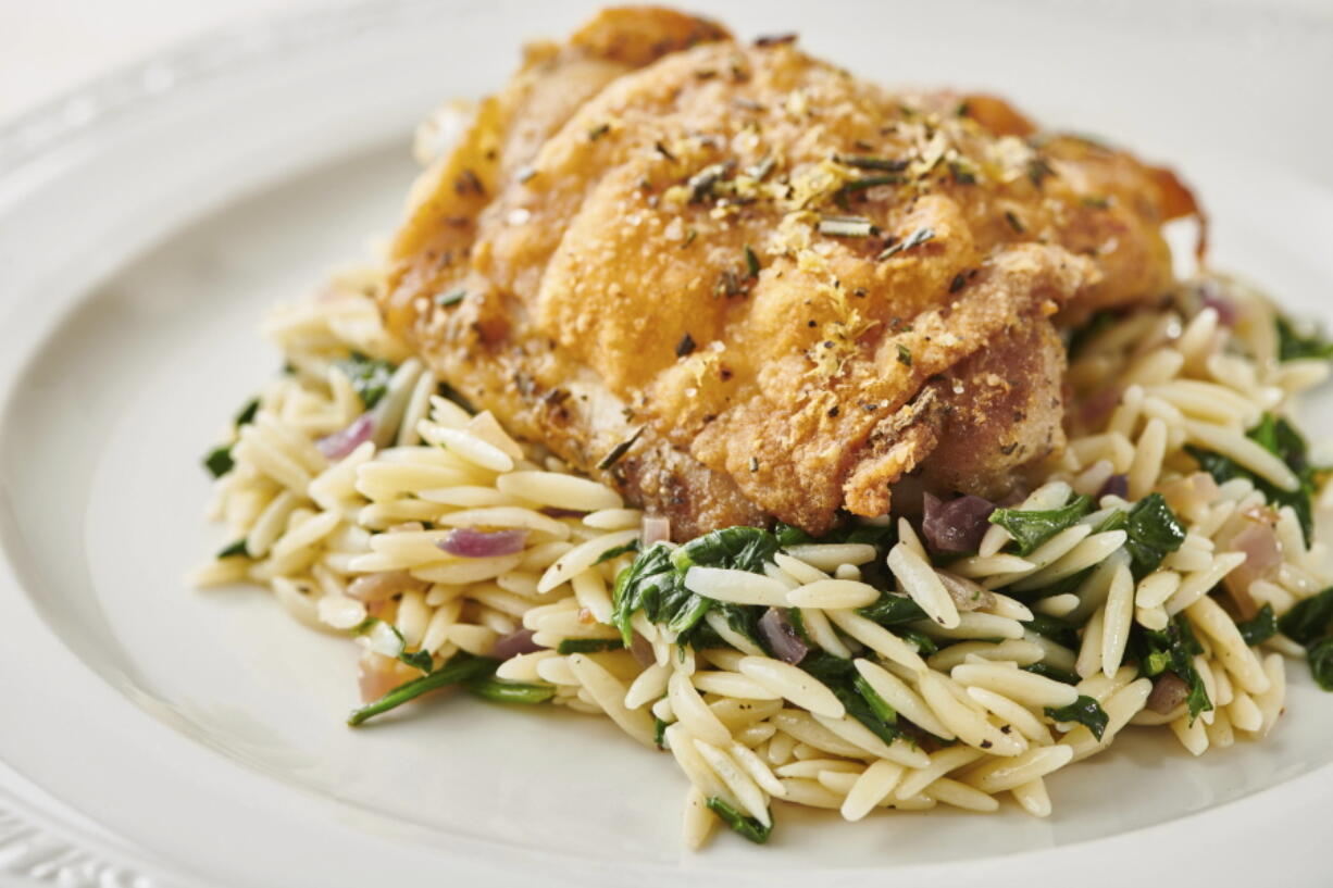 Dress up roasted chicken thighs with rosemary. Fresh herbs enhance all kinds of dishes in summertime and all year.