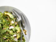 This image released by Milk Street shows a recipe for Arugula and Avocado Salad with Jalape?o Vinaigrette.