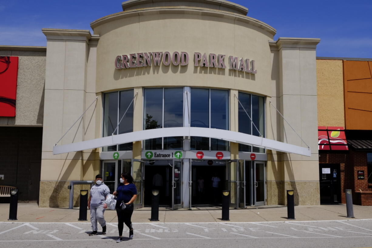 FILE - Shoppers leave the Greenwood Park Mall on May 4, 2020, in Greenwood, Ind. Indianapolis Metropolitan Police say two people were killed in a shooting Sunday, July 17, 2022, at the mall in Greenwood and multiple other people were taken to hospitals with injuries.