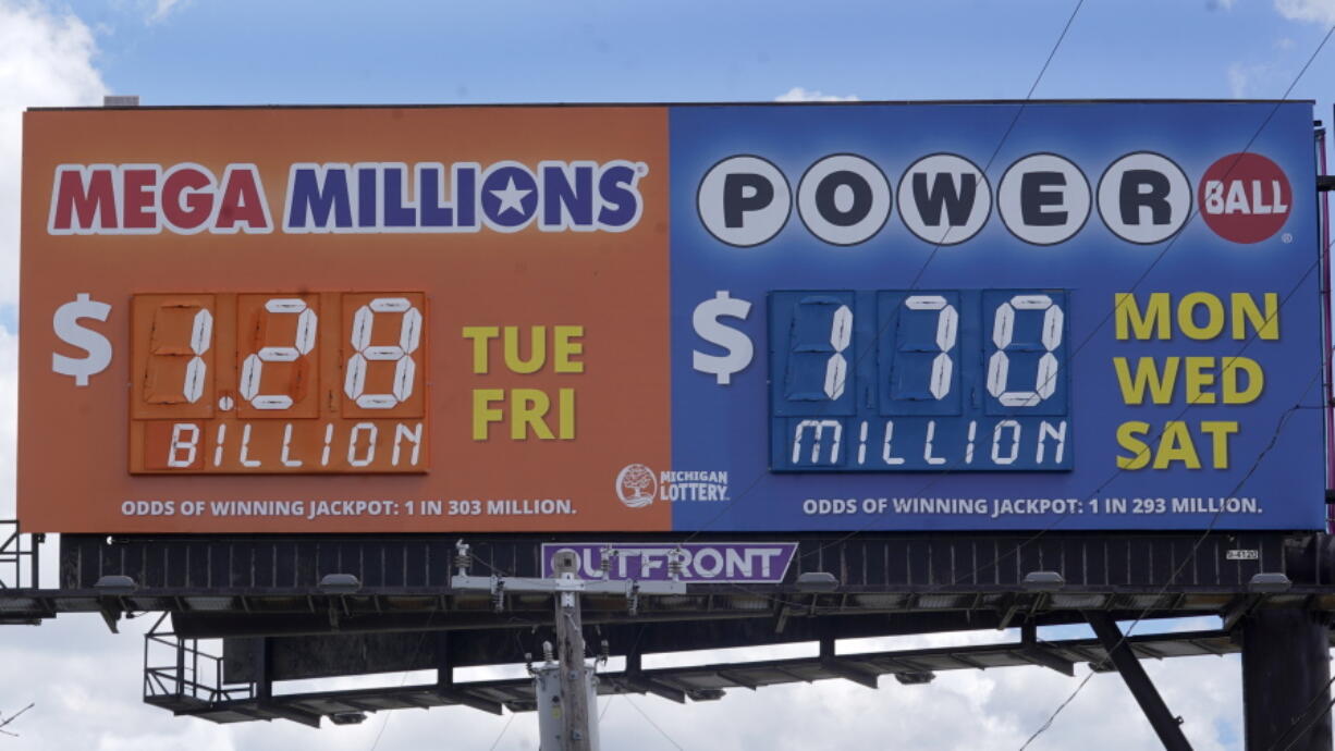 A sign displays the Mega Millions lottery jackpot in Detroit, Friday, July 29, 2022.