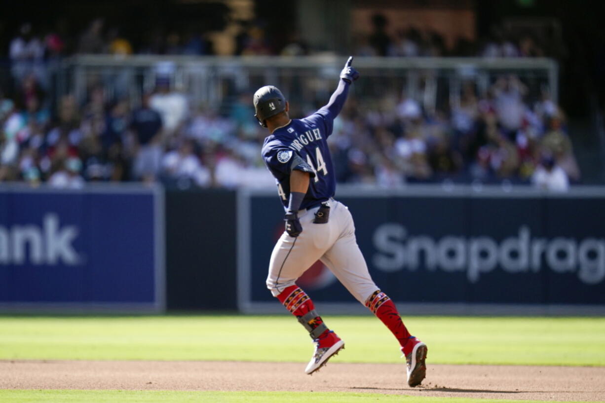 Seattle Mariners' Julio Rodriguez reacts after hitting a two-run home run during the fourth inning of a baseball game against the San Diego Padres, Monday, July 4, 2022, in San Diego.