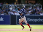 Seattle Mariners' Julio Rodriguez reacts after hitting a two-run home run during the fourth inning of a baseball game against the San Diego Padres, Monday, July 4, 2022, in San Diego.