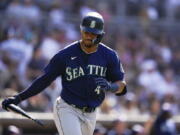 Seattle Mariners' Julio Rodriguez reacts after hitting a two-run home run during the fourth inning of a baseball game against the San Diego Padres, Monday, July 4, 2022, in San Diego.