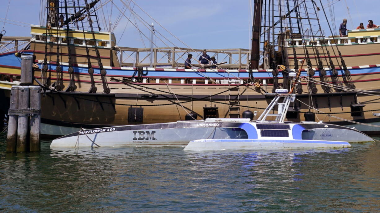 Mayflower Autonomous Ship floats next to the replica of the original Mayflower, Thursday, June 30, 2022, in Plymouth, Mass. The crewless robotic boat retraced the 1620 sea voyage of the Mayflower.