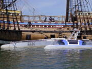 Mayflower Autonomous Ship floats next to the replica of the original Mayflower, Thursday, June 30, 2022, in Plymouth, Mass. The crewless robotic boat retraced the 1620 sea voyage of the Mayflower.