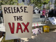 FILE - A sign urges the release of the monkeypox vaccine during a protest in San Francisco, July 18, 2022. The mayor of San Francisco announced a legal state of emergency Thursday, July 28, 2022, over the growing number of monkeypox cases. Public health officials warn that moves by rich countries to buy large quantities of monkeypox vaccine, while declining to share doses with Africa, could leave millions of people unprotected against a more dangerous version of the disease and risk continued spillovers of the virus into humans.