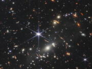 This image provided by NASA on Monday, July 11, 2022, shows galaxy cluster SMACS 0723, captured by the James Webb Space Telescope. The telescope is designed to peer back so far that scientists can get a glimpse of the dawn of the universe about 13.7 billion years ago and zoom in on closer cosmic objects, even our own solar system, with sharper focus.