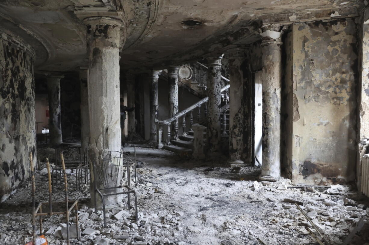 FILE - A view inside the Mariupol theater damaged during fighting in Mariupol, in territory under the government of the Donetsk People's Republic, eastern Ukraine, Monday, April 4, 2022. Ministers from dozens of nations are meeting on Thursday, July 14, 2022 in the Netherlands to discuss with the International Criminal Court's chief prosecutor how best to coordinate efforts to bring to justice perpetrators of war crimes in Ukraine.