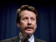 FILE - U.S. Food and Drug Administration Commissioner Dr. Robert Califf speaks at a news conference at the Hubert H. Humphrey Building in Washington, Thursday, May 5, 2016. Califf says a comprehensive review of the opioid painkillers that triggered the nation's ongoing drug overdose epidemic is in the works. But he faces skepticism about the long-promised review from lawmakers, experts and advocates after years of delay.