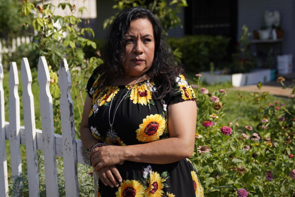 Francisca Acu?a, who works as an activist around climate issues and used to teach people to buy flood insurance, poses for a photo at her home, Thursday, July 14, 2022, in Austin, Texas. As climate change drives stronger and wetter hurricanes, and increases flood risk in many parts of the country, FEMA has updated its flood insurance program to more accurately reflect risk, but also make the program more solvent. Flood insurance for Acuna was about $450 a year under FEMA's old pricing system, and now nearly $1,900 under the new one.