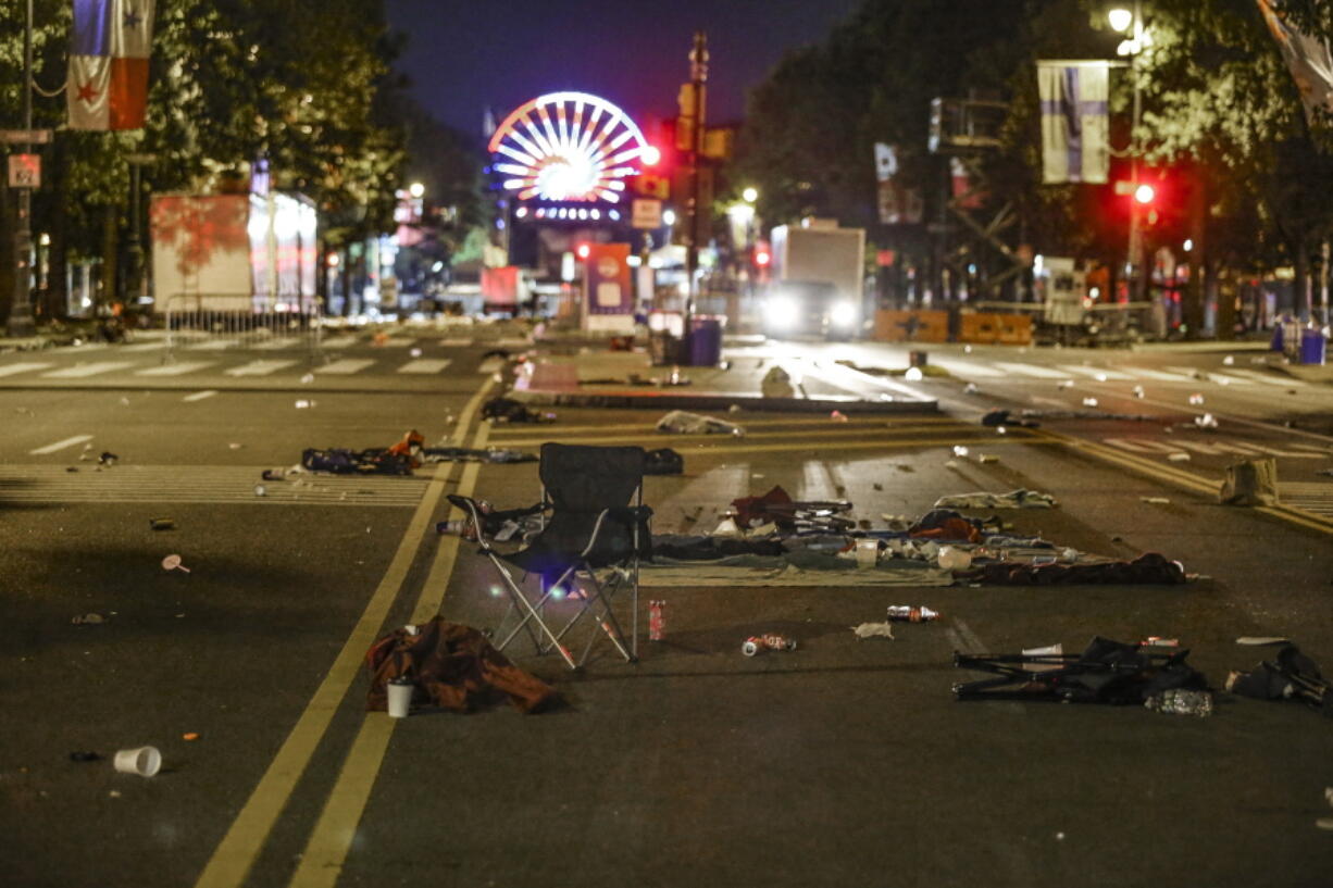 Debris left in the street as people fled as gunshots rang out on the Parkway during the July 4th fireworks show in Philadelphia on Monday, July 4, 2022.  Two Philadelphia police officers working at the city's Fourth of July celebration suffered graze wounds when shots rang out, causing scores of frightened people to flee the scene on foot.  (Steven M.