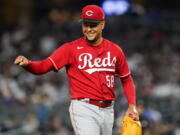 Cincinnati Reds starting pitcher Luis Castillo gestures to a teammate at the end of the sixth inning of the team's baseball game against the New York Yankees on Thursday, July 14, 2022, in New York.