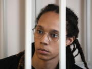 WNBA star and two-time Olympic gold medalist Brittney Griner sits in a cage at a court room prior to a hearing, in Khimki just outside Moscow, Russia, Wednesday, July 27, 2022. American basketball star Brittney Griner returned Wednesday to a Russian courtroom for her drawn-out trial on drug charges that could bring her 10 years in prison of convicted.