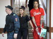 WNBA star and two-time Olympic gold medalist Brittney Griner is escorted to a courtroom for a hearing, in Khimki just outside Moscow, Russia, Thursday, July 7, 2022. Jailed American basketball star Brittney Griner returns to a Russian court on Thursday amid a growing chorus of calls for Washington to do more to secure her release nearly five months after being arrested on drug charges.