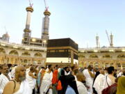 Thousands of Muslim pilgrims circumambulate around the Kaaba, the cubic building at the Grand Mosque, in the Saudi Arabia's holy city of Mecca, Tuesday, July 5, 2022. Saudi Arabia is expected to receive one million Muslims to attend Hajj pilgrimage, which will begin on July 7, after two years of limiting the numbers because coronavirus pandemic.