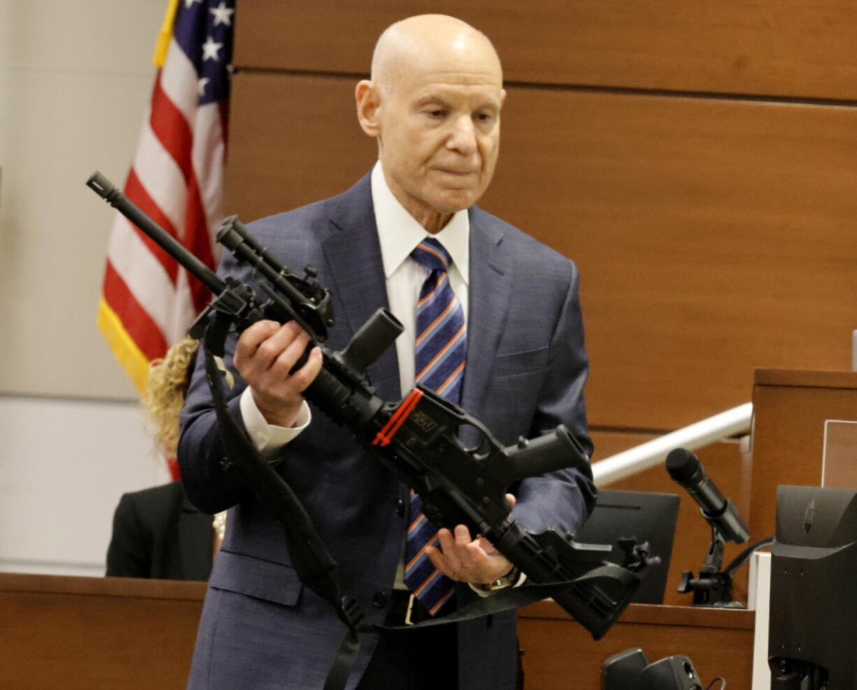 Assistant State Attorney Mike Satz, checks into evidence the weapon used in the MSD shooting during the penalty phase of shooter Nikolas Cruz at the Broward County Courthouse in Fort Lauderdale on Monday, July 25, 2022. Cruz previously plead guilty to all 17 counts of premeditated murder and 17 counts of attempted murder in the 2018 shootings.