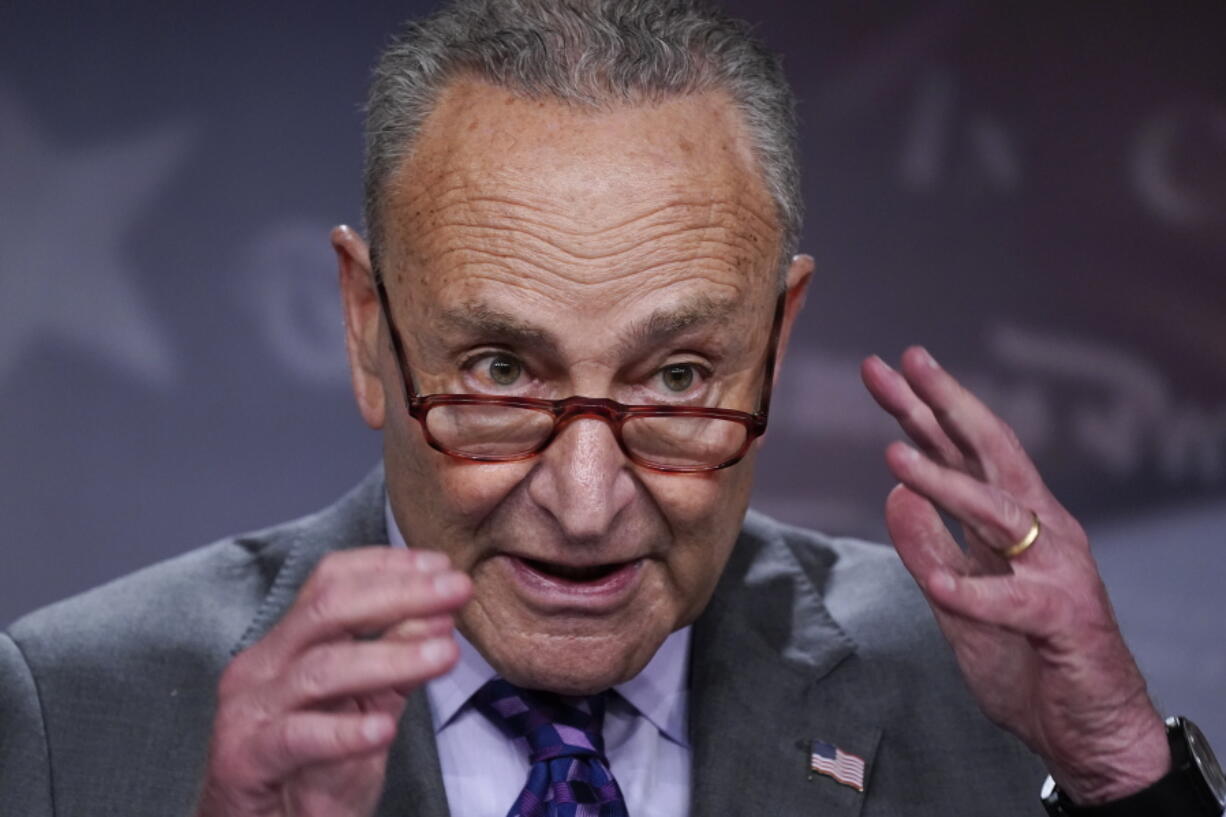 Senate Majority Leader Chuck Schumer, D-N.Y., speaks with reporters following a closed-door caucus lunch, at the Capitol in Washington, Tuesday, July 19, 2022. (AP Photo/J.