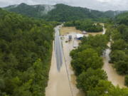 Buildings and roads are flooded near Lost Creek, Ky., Thursday, July 28, 2022. Heavy rains have caused flash flooding and mudslides as storms pound parts of central Appalachia. Kentucky Gov. Andy Beshear says it's some of the worst flooding in state history. (Ryan C.