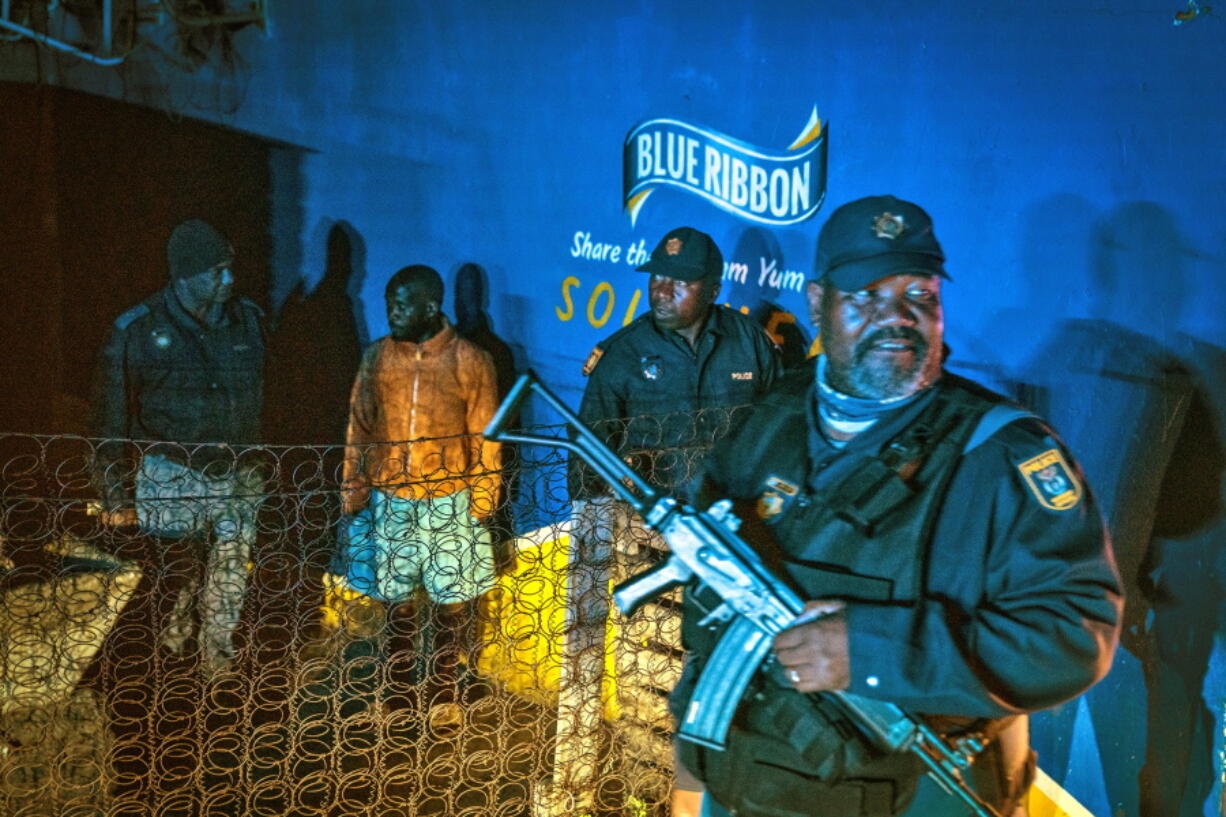 Police patrol an area in Soweto, South Africa Tuesday, July 12, 2022 in search of illegal firearms following the weekend shooting in a bar which claimed 16 people. South African police are searching for illegally-held guns in patrols of Johannesburg's Soweto township, following a spate of bar shootings that have rocked the nation.