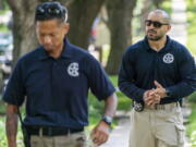 FILE - U.S. Marshals patrol outside the home of Supreme Court Justice Brett Kavanaugh, in Chevy Chase, Md., June 8, 2022. The Marshal of the U.S. Supreme Court has asked Maryland officials to step up the enforcement of laws she says prohibit picketing outside the homes of the justices who live in the state. The request came about a month after a California man was found with a gun, knife and pepper spray near the Maryland home of Kavanaugh after telling police he was planning to kill the justice.