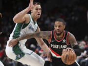 For Damian Lillard, right, staying with the Trail Blazers is a point of pride for the six-time All Star who has spent his whole career in Portland.