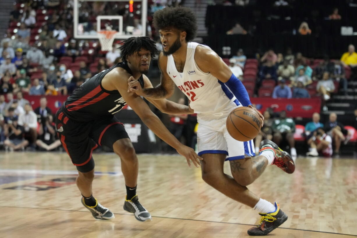 Detroit Pistons' Isaiah Livers drives against Portland Trail Blazers' Shaedon Sharpe during the first half an NBA summer league basketball game Thursday, July 7, 2022, in Las Vegas.