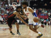 Detroit Pistons' Isaiah Livers drives against Portland Trail Blazers' Shaedon Sharpe during the first half an NBA summer league basketball game Thursday, July 7, 2022, in Las Vegas.