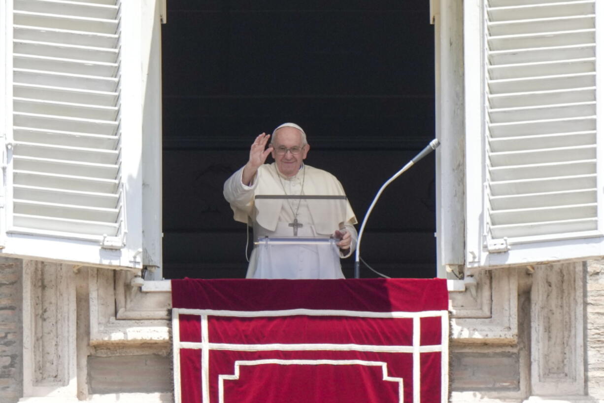 Pope Francis recites the Angelus noon prayer from the window of his studio overlooking St.Peter's Square, at the Vatican, Sunday, July 3, 2022.